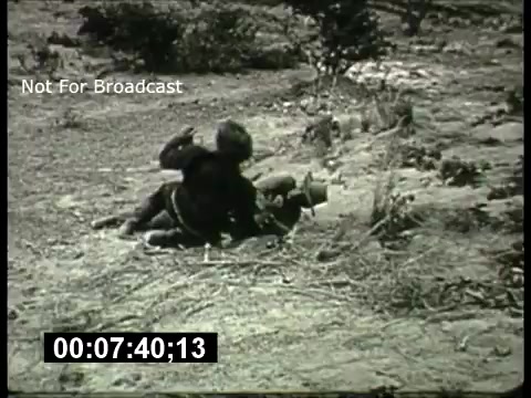 The still likely features a scene from a 1960s ABC Sunday Night Movie promo, possibly showcasing an outdoor or action-oriented theme. It captures a dramatic moment with characters engaged in a physical struggle amidst a natural landscape, typical of the action or adventure films popular at the time. The frame includes a timecode, indicating its archival status, and a label stating 'Not For Broadcast.'