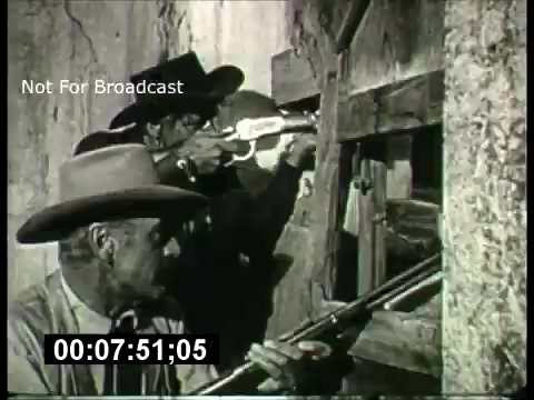 The still depicts two men in cowboy hats, poised to fire rifles. They are shown looking through a wooden barricade, suggesting a tense or dramatic moment. The black-and-white image captures the classic western aesthetic typical of 1960s film promos. The note 'Not For Broadcast' indicates it was likely for internal use.