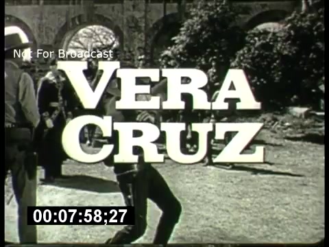The still from the ABC Sunday Night Movie promos features the title 'Vera Cruz' prominently displayed in bold, stylized letters. The image has a vintage look characteristic of 1960s television, with a scene likely depicting a western or dramatic setting. It includes elements suggesting action, possibly involving characters in period attire. The timecode at the bottom indicates a segment of the promo, labeled 'Not For Broadcast.' The overall aesthetic reflects the nostalgic vibe of classic movie promotions from that era.