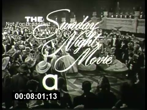 The still showcases a classic promotional graphic for 'The Sunday Night Movie' on ABC from the 1960s. It features elegant script lettering that reads 'The Sunday Night Movie,' set against a vibrant scene of a ballroom filled with elegantly dressed people, suggesting a glamorous atmosphere. The image is framed in black and white, typical of the era, encapsulating a sense of nostalgia for television programming of that time. A timestamp at the bottom indicates it's from a film reel, noting 'Not For Broadcast.'