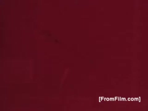 The still from the Knorr Caldo De Galinha soup commercial features a rich, warm red background typical of 1970s Brazilian advertising. The simplicity of the frame emphasizes the nostalgic and comforting qualities associated with the product. The visual aesthetic reflects the era’s style, aiming to evoke a sense of home and tradition in culinary practices.