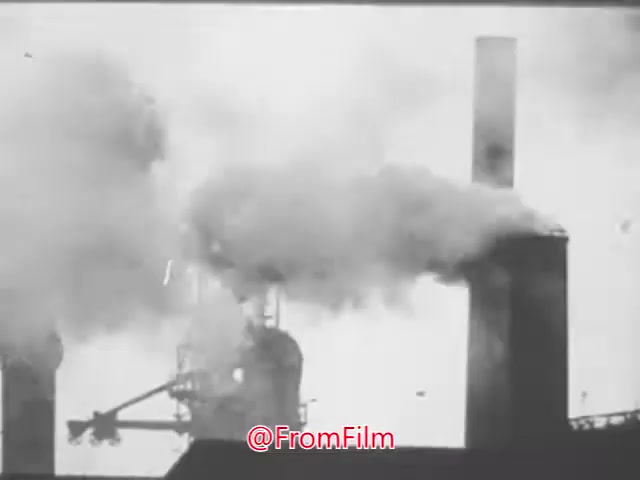 The still from 'A Matter of Life or Breath' depicts industrial smokestacks emitting thick plumes of smoke against a stark background. This imagery evokes the themes of air pollution and its detrimental effects on health, particularly in relation to tuberculosis and respiratory diseases. The voice-over calls for action, urging viewers to join local organizations in the fight for cleaner air, highlighting the urgency of addressing environmental issues for the sake of public health.