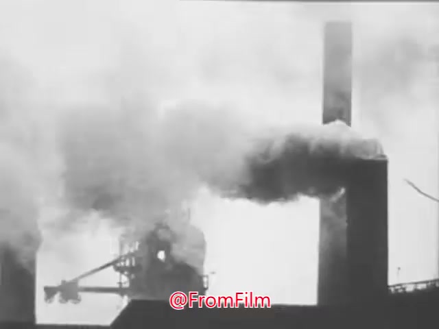 The still depicts a smokestack emitting thick black smoke into a hazy atmosphere, emphasizing industrial pollution. The imagery contrasts an ideal of clean air with the harsh reality of environmental degradation, aligning with the PSA's message about the importance of fighting air pollution and preserving public health.