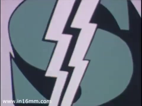 The still features a stylized graphic of a dollar sign, incorporating dynamic lightning bolts. The design reflects the vibrant and graphic style of the 1970s, aiming to convey energy and modernity. This aesthetic aligns with the promotional tone typical of banking advertisements from that era, emphasizing innovation and accessibility associated with the ATM card service offered by Brenton Banks in Iowa before its acquisition by Wells Fargo in 2000.