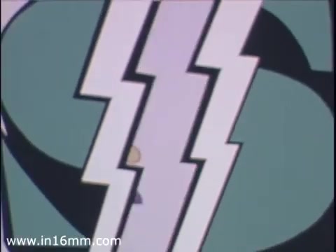 The still from the Brenton Banks (Iowa) ATM card commercial features a stylized, graphic design typical of the 1970s, with bold shapes and vibrant colors. The image likely emphasizes the modernity and speed of ATM usage during that era, using sharp lines and contrasting colors to create visual interest. The playful, cartoon-like style suggests a lighthearted yet promotional tone aimed at highlighting the convenience of banking services.