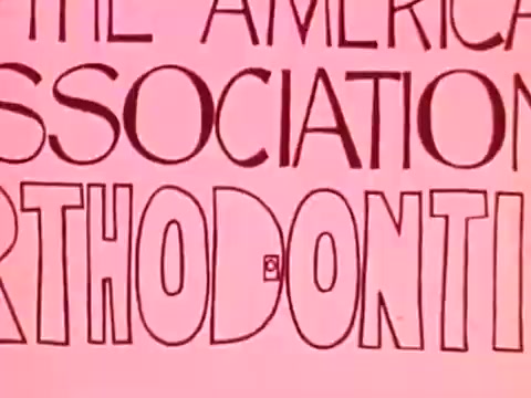 The still features bold, playful lettering prominently displaying the words 'THE AMERICAN ASSOCIATION OF ORTHODONTISTS.' The background is a soft pink, creating a bright and cheerful aesthetic typical of 1970s graphics. The design reflects the era's style, emphasizing clarity and engagement.