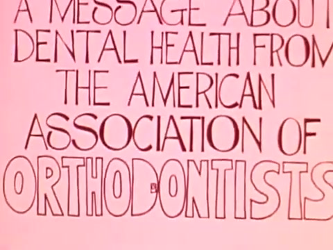 The still features colorful, playful lettering promoting dental health, emphasizing the message from the American Association of Orthodontists. The bright background enhances the retro 1970s aesthetic, reflecting the era's promotional style. The focus is on engaging viewers with a clear, friendly message about orthodontics.   Follow us on Twitter @FromFilm.