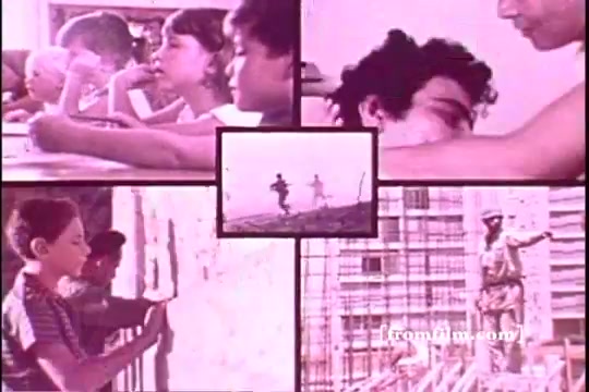 The still from 'Israel Emergency Fund 2 - PSA' features a split-screen format with four images. In the top corners, children's faces depict contemplation and curiosity, while the lower corners show scenes of playful activity and construction work. A central square highlights two children running, creating a sense of movement and hope. The overall tone suggests themes of childhood, community, and resilience amidst challenges. The colors are soft, typical of older film stock, adding a nostalgic feel.