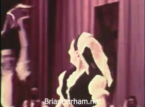 The still features performers in traditional attire, likely engaging in a folk dance. The backdrop includes draped fabric, suggesting a stage setting. The festival, organized by Robert Morris Junior College, promotes cultural celebration at the Civic Arena on June 7th, 8th, and 9th, 1968. The lively atmosphere hints at a community gathering focused on folk traditions.