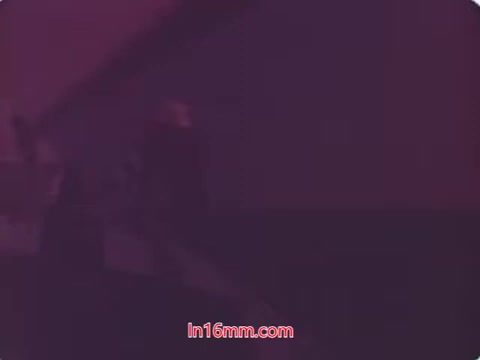 The still from the 'Dentyne Dynamints' commercial features a visual style typical of the 1970s, characterized by vibrant colors and dynamic angles. The focus is likely on showcasing the product in a playful or engaging manner. Bold typography might feature the product’s name, emphasizing freshness and enjoyment. Overall, it captures the spirit of the time, blending nostalgia with a marketing appeal aimed at conveying an exciting experience related to the gum.