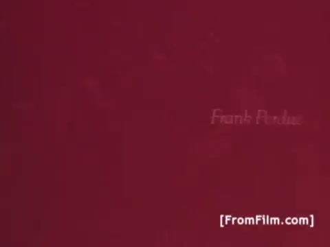 The still from the 'Perdue Chicken Commercials - 1970's' features a simple background with the name 'Frank Perdue' prominently displayed. The use of a plain color emphasizes the focus on the brand and its spokesperson. This still serves as a title card or introduction to the commercials that highlight the tagline, 'It takes a tough man to grow a tender chicken,' which reflects the brand's commitment to quality poultry.