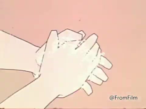 The still from the 'Salmonella PSA - American Medical Association 1960's' depicts a pair of hands actively washing with soap, set against a plain background. This imagery emphasizes the importance of hand hygiene in preventing salmonella infections, which are commonly contracted through contaminated food. The visual serves as a reminder of basic food safety practices to combat foodborne illness.