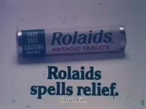 The still features a tube of Rolaids antacid tablets prominently displayed, with the tagline 'Rolaids spells relief' below it. This image evokes the brand's well-known slogan, 'How do you spell relief? R-O-L-A-I-D-S,' which became iconic in the 1970s. The connection to Major League Baseball is highlighted through sponsorship of the Rolaids Relief Man of the Year Award, celebrating outstanding relief pitchers. The overall presentation emphasizes the product's efficacy in providing quick relief from heartburn and indigestion.