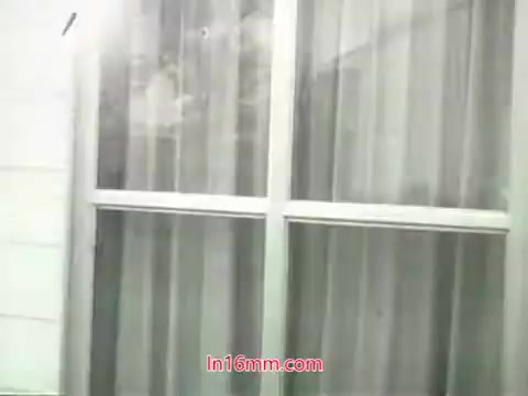 The still from the PSA features a window with a grid design, possibly depicting a domestic or urban environment. The glass appears dirty or fogged, which aligns with the message about air pollution. The context of the voiceover highlights the contrast between washable items and the inability to cleanse the lungs from polluted air, emphasizing public health concerns related to air quality. The overall tone is cautionary, urging viewers to take action to improve their environment.