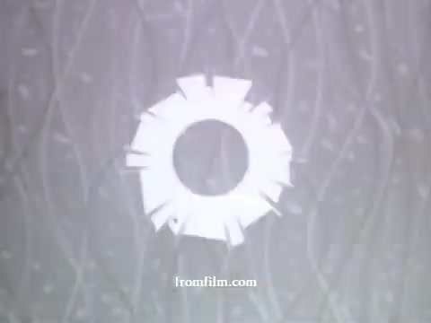 The still appears to be a stylized graphic featuring a circular design, possibly representing the American Express logo or theme. The background may have a textured or abstract pattern, typical of the animation style from UPA during the late 1950s. The overall feel is minimalist and colorful, emphasizing the modern aesthetic that UPA was known for in its advertising work.