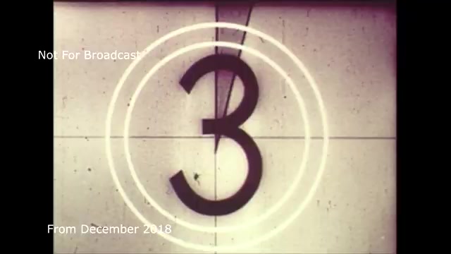 The still features a vintage countdown format, specifically highlighting the number '3' within a classic film frame. This frame symbolizes the transfer process of a TV commercial from film to video, evoking a sense of nostalgia associated with traditional filmmaking. The text overlays indicate that it is not for broadcast, and the date suggests it was archived in December 2018. The mention of audio sync issues hints at the technical challenges faced during the transfer but also implies that these have been resolved. Overall, it captures a moment of retro cinematic history.