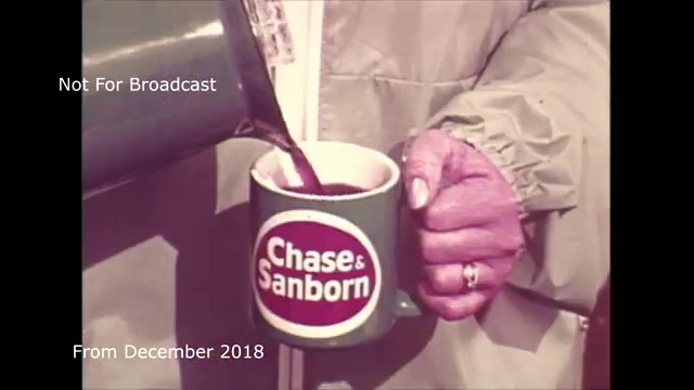 The still shows a hand pouring coffee from a pot into a green mug prominently featuring the logo of Chase and Sandborn. The hand appears to have a ring, and the scene is likely nostalgic, reflecting a retro aesthetic common in older commercials. The text overlay indicates that this content is not meant for broadcast and that it dates back to December 2018. You mention dealing with audio sync issues that were present in the original transfer from film to video, which might explain the delay in sharing this archival material.