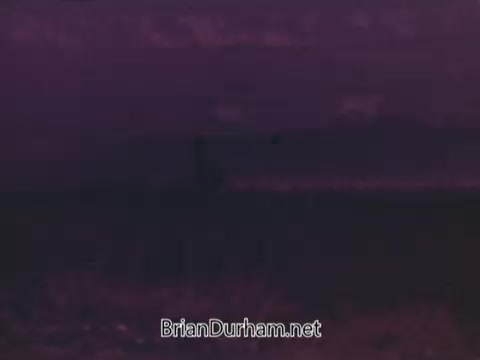 The still from the 1972 Coca-Cola commercial for the Munich Olympics captures a moody atmosphere, likely depicting a vast landscape with subtle shifts in color and lighting. The tones suggest a sense of nostalgia or reflection, potentially echoing the event's significance and the somber context of the Munich games, which were marked by tragedy. The image aims to evoke emotions associated with both the spirit of the Olympics and the brand's connection to global unity.