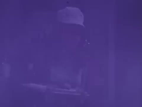 The still from the Pepsodent Toothpaste commercial features a blurred figure, possibly a person engaged in an activity related to dental care. The overall tone is purple-hued, creating a vintage or stylized aesthetic typical of mid-20th century advertisements. The focus seems to be on demonstrating the product's benefits, likely through engaging imagery or actions.