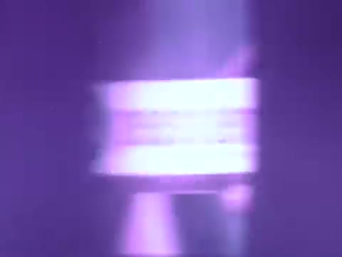 The still features a close-up of a Pepsodent toothpaste tube, illuminated with a purple hue. The label is prominent, showcasing the product name. The overall aesthetic is vintage, characteristic of mid-20th century advertising, with a focus on the toothpaste's branding. The background appears blurred, emphasizing the tube and creating a nostalgic vibe.