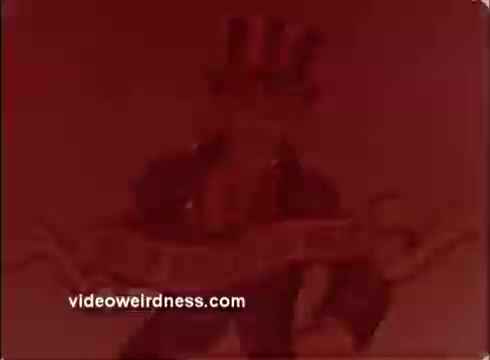 The still shows a stylized depiction of Uncle Sam, the iconic symbol of the United States, dressed in traditional attire with a top hat and American flag motif. The background has a reddish tint, creating a vintage feel typical of 16mm prints. The overall imagery reflects a patriotic theme, likely tied to a public service announcement by the National Alliance of Businessmen.