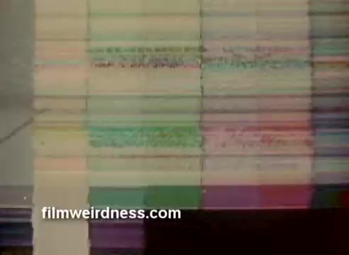 The still features a colorful, abstract representation from a 16mm film, likely showcasing a scene or segment from the 1970 Barney's commercial and a partial CBS Christmas story. The color correction has been recently improved, enhancing the visual appeal. The commercial is notable for winning a CLIO award, highlighting its impact and recognition in advertising.