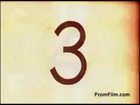 The still features a faded, vintage background with a large, bold '3' prominently displayed in the center. The texture suggests age, typical of 16mm film from the 1970s, possibly indicating the countdown or segment number in the context of an educational or promotional film by Bell System. The overall aesthetic is nostalgic, capturing the essence of that era's film production.
