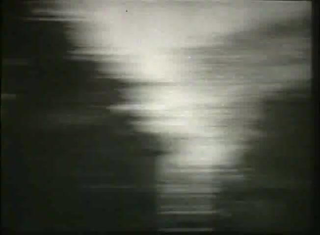 The still from 'Story Without End' showcases a blurred, abstract image, likely depicting motion or light reflections, which may symbolize the flow of communication or information. Given its context as a Bell System film from the late 1940s, it likely serves to evoke a sense of connection or the dynamic nature of telecommunications, complementing the film’s exploration of the network and central office operations during that era.