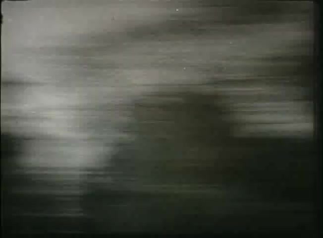 The still from 'Story Without End' features a blurred scene, likely indicative of motion. This visual effect suggests a dynamic perspective, perhaps representing the fast-paced nature of communication or the flow of information during the late 1940s. The film aims to showcase the Bell System's network, incorporating themes of connectivity and technological advancement, with a focus on central office operations. The abstract quality of the image aligns with the era's exploration of innovation in telecommunications.