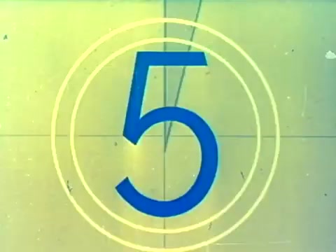 The still features a countdown, showcasing the number '5' prominently in a bold blue font, surrounded by concentric yellow circles. This stylistic choice reflects the vintage film aesthetic typical of the era, suggesting a transition into the trailer's content. The context indicates it's from the trailer for the Italian film 'When Women Lost Their Tails,' likely intended to engage an American audience during its rerelease in the mid-1970s.
