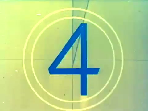The still features a vintage countdown, showing the number '4' in bold blue against a yellow background, framed by concentric circles. This presentation style reflects the aesthetics of mid-20th century film trailers. The image likely serves as a transition element in the trailer for the 1970 Italian film 'When Women Lost Their Tails,' indicating the upcoming scene or segment. The restoration from 16mm negative emphasizes the film's historical significance and its appeal for a potential rerelease in the mid-1970s.