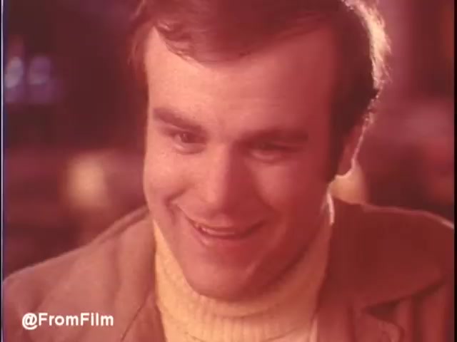 This 16mm still captures a moment from a 1976 McDonald's restaurant commercial set in New Orleans. It features a man with a warm smile, dressed in a light sweater and jacket, suggesting a casual dining atmosphere. The soft, warm colors evoke a nostalgic vibe, typical of the era's advertising style. The scene likely conveys a positive dining experience, inviting viewers to consider visiting McDonald's. Follow us on Twitter @FromFilm.
