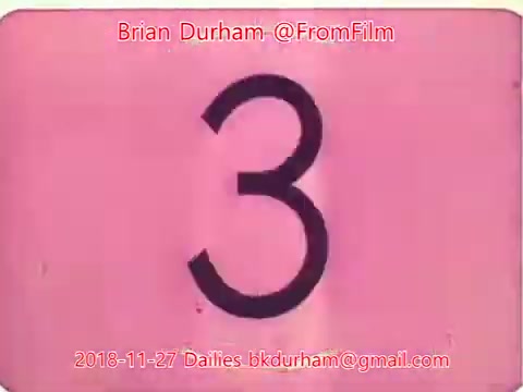 The 16mm still features a large, bold number '3' against a pink background. It appears to be a countdown or marker from film dailies dated November 27, 2018. The image includes attribution to Brian Durham and the email for dailies.