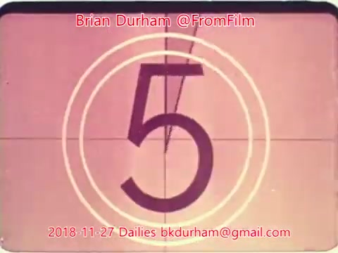The still features a vintage film countdown with the number '5' prominently displayed in the center. The design includes concentric circles typical of old film projectors, and the overall aesthetic reflects a mid-20th-century film style. The image is dated '2018-11-27' and includes a watermark with 'Brian Durham @FromFilm' and an email address for contact.