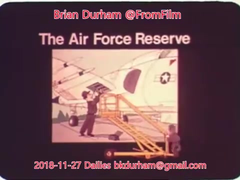 The still features an animated image related to the Air Force Reserve. It depicts a character working on an aircraft, with a ladder and tools, emphasizing maintenance or support roles within the reserve. The title 'The Air Force Reserve' is prominently displayed, alongside contact information and a date related to the film dailies. The overall tone suggests a focus on the importance of the Air Force Reserve and its contributions.