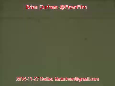 The still features a simple, mostly blank background, with the text overlay indicating the date, watermark, and the email address associated with Brian Durham from '@FromFilm.' The color palette is muted, likely reflecting the characteristics of 16mm film stock.