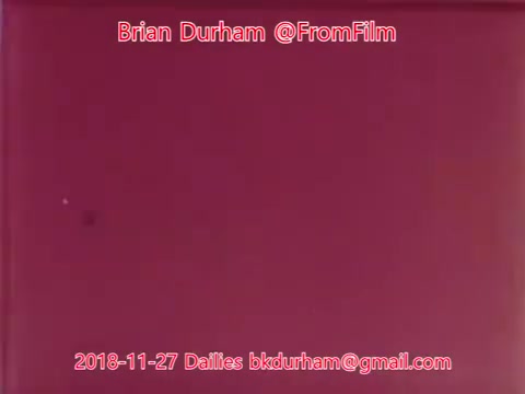 The 16mm still from '@FromFilm Dailies' dated November 27, 2018, features a solid pink background. Overlaid text includes the name 'Brian Durham,' the handle '@FromFilm,' the date, and an email address. The image appears minimalist with no additional visual elements.