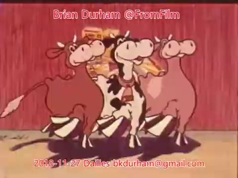 The still features three animated cows dancing joyfully against a colorful background. The cows have exaggerated expressions and playful poses, contributing to a lively and whimsical atmosphere. The image is reminiscent of vintage animation styles, likely taken from a cartoon or commercial context. The overlay includes the date and contact information for Brian Durham, indicating it is part of a film archive.