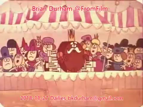 The still features a colorful animated scene, likely from a theatrical performance, with a central character resembling a red, mustachioed figure wearing a crown. Surrounding him are various characters, including a mix of elegantly dressed individuals and others with distinct expressions, all set against a striped tent-like backdrop. The image conveys a whimsical, festive atmosphere typical of animated shorts from that era.