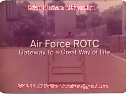 The still features a scene related to the Air Force ROTC, labeled as 'Gateway to a Great Way of Life.' It is set in a military or training environment, likely showcasing activities associated with the program. The date and contact details of the creator, Brian Durham, are also prominently displayed. The overall aesthetic has a vintage or nostalgic quality, typical of 16mm film.