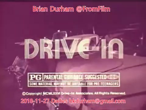 The still features a vintage 16mm film frame with the title 'DRIVE-IN' prominently displayed. It includes a 'PG' rating along with the note 'Parental Guidance Suggested.' The text appears in a nostalgic style, suggesting a retro theme. Additionally, there are credits for Brian Durham and details indicating the date of the dailies as November 27, 2018. The overall color scheme has a muted, vintage aesthetic typical of older film presentations.