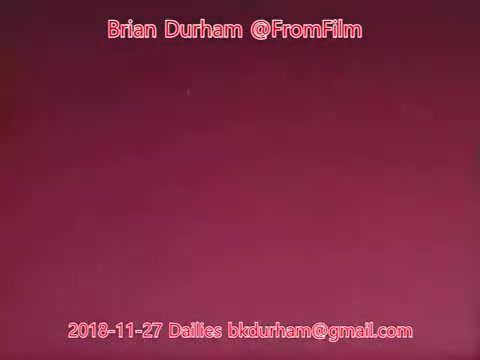 The image consists of a soft, gradient background in shades of pink. Overlayed text indicates the creator, Brian Durham, along with the date of the dailies (November 27, 2018) and an email address. The overall aesthetic appears minimalistic, likely intended for a film project showcasing footage or behind-the-scenes content.