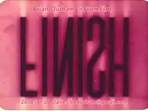 The still features the word 'FINISH' prominently displayed in bold, stylized letters. The background has a pink hue, giving it a vintage aesthetic typical of 16mm film. The image conveys a sense of closure, possibly signaling the end of a film reel or project. Text overlays provide attribution and date referencing Brian Durham and a specific dailies entry from November 27, 2018.