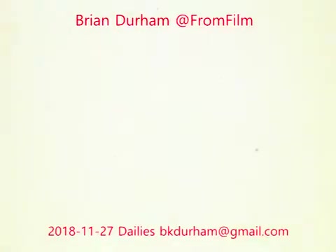 The still features a simple, mostly blank background with text overlaid in red. The text includes the name 'Brian Durham,' the handle '@FromFilm,' the date '2018-11-27,' and an email address. The overall appearance suggests it is a title card or a note related to film dailies, specifically referencing ffn035-dristan.