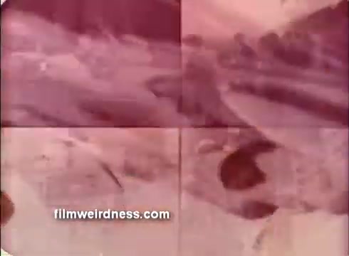 The still depicts a split-screen composition with four quadrants, presenting scenes related to the Air Force from the 1970s. The color palette is dominated by warm, reddish tones, giving it a vintage feel. The imagery suggests military activity and possibly training or operations, consistent with the context of a public service announcement promoting the Air Force. Overall, it captures the era's aesthetic and themes of military service.