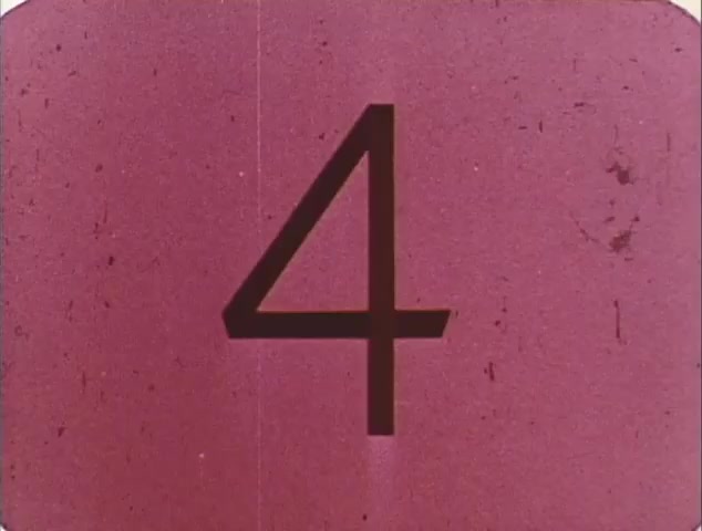 The still shows the number '4' prominently displayed on a faded pink background, likely indicating a countdown or segment marker for the TV spot trailer. This could suggest it's part of a classic film promotion, possibly for the reissue of 'Dirty Mary, Crazy Larry' and 'Vanishing Point.' The visual quality indicates it's from an older 16mm source, typical for archival footage. Overall, it serves as a nostalgic reminder of the era's marketing style.