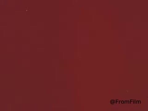 The still from the 'American Dental Association animated PSA - 1969' features a simple background with a reddish hue. There are no distinct images or characters visible, suggesting it may serve as a transitional or filler frame within the animation. The overall aesthetic aligns with the style typical of animated PSAs from that era.