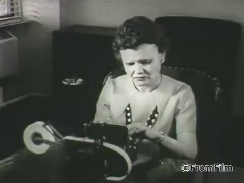 The still from the 1968 PSA by the American Foundation for the Blind depicts a woman using a Braille typewriter. She appears focused and determined, emphasizing the importance of accessibility and independence for individuals with vision loss. The setting suggests a professional or home office environment, highlighting the tools that enable blind individuals to communicate and work effectively. The black and white format evokes a sense of historical context, illustrating challenges and advancements in support for people with vision impairments at that time.