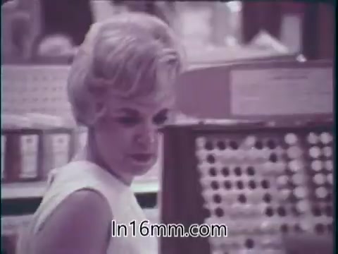 The still from the 'Food and Drug Administration PSA - 1960s' captures a woman shopping in a grocery store, highlighting the abundance of food products available. She appears contemplative, possibly evaluating her choices among rows of packaged items. The PSA emphasizes the safety and effectiveness of foods and drugs in the marketplace, portraying them as essential elements for a healthy and beautiful life. The message aligns with the era's focus on consumerism and health awareness, marking the FDA's ongoing commitment to public safety in the food and drug sectors.