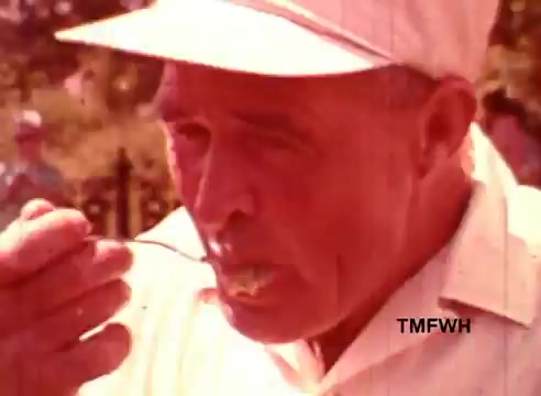 The still from 'Birdseye New England Style Vegetables' features an older man in a light-colored cap and shirt, tasting food with a spoon. His expression suggests he is savoring the flavor. The scene captures a warm, nostalgic vibe, reflecting themes of home-cooked meals and fresh produce. The color tones are warm, typical of 16mm film, adding to the vintage feel of the moment.